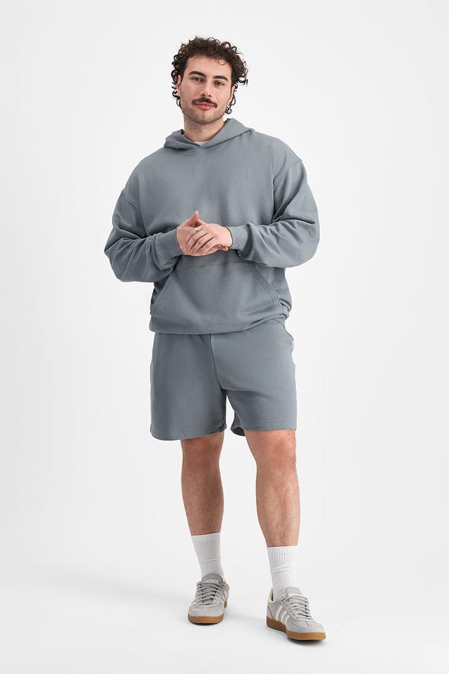 Sam (He/Him) wears size XL and is 178cm tall with 112cm chest