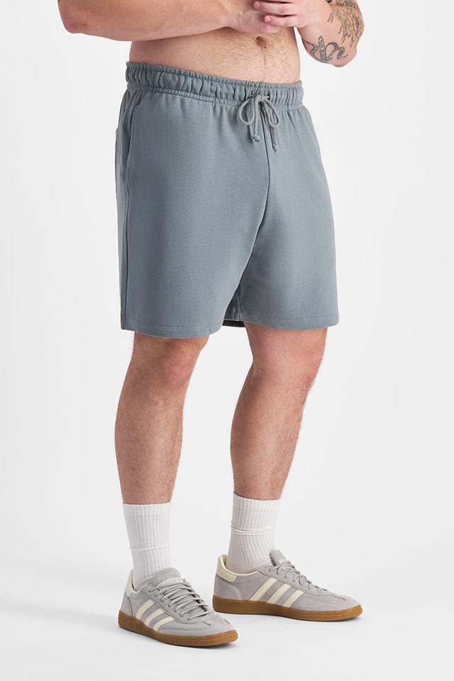 Sam (He/Him) wears size XL and is 178cm tall with 112cm chest