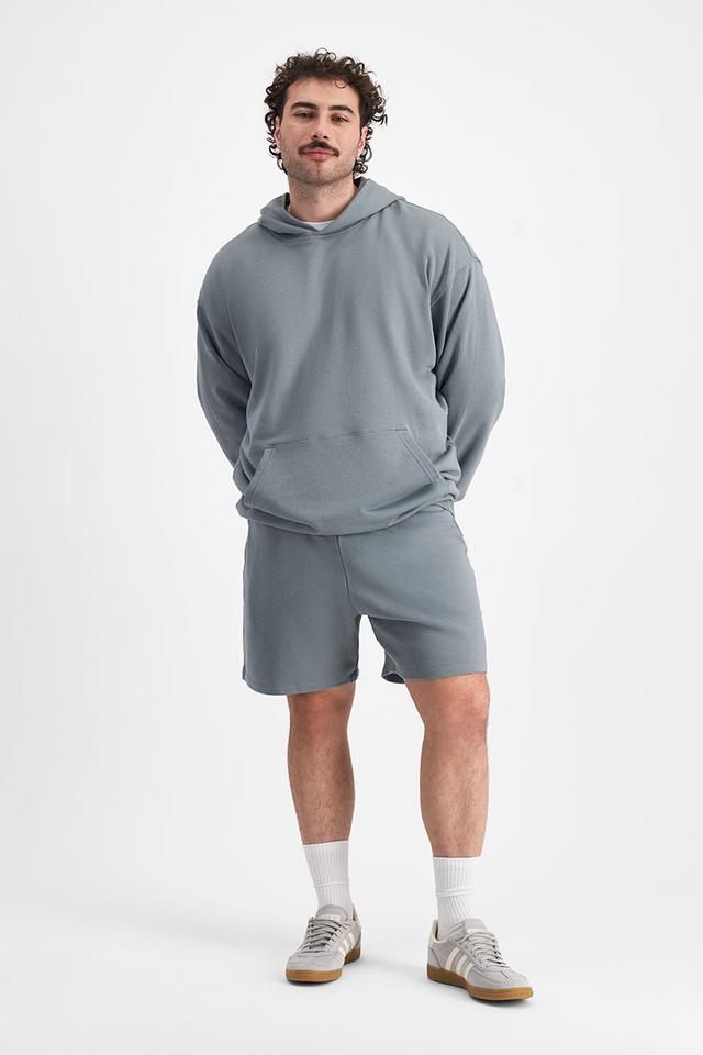 Sam (He/Him) wears size XL and is 178cm tall with 112cm chest