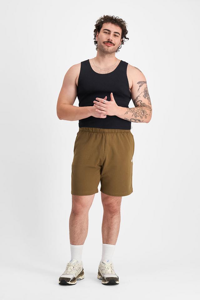 Sam (He/Him) wears size XL and is 178cm tall with 112cm chest