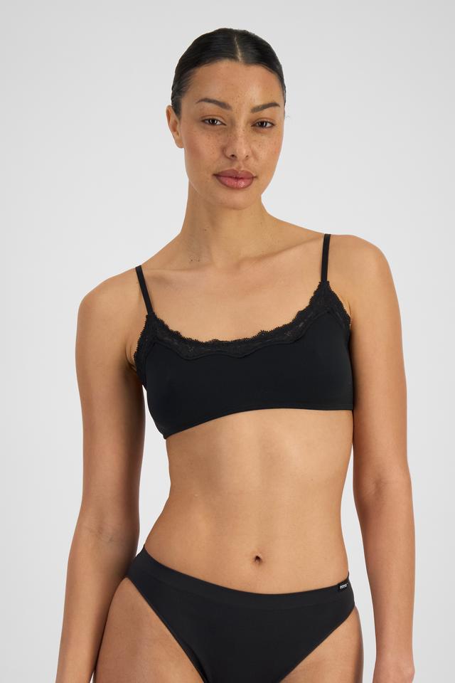 MILA (She/Her) wears size 12 and is 176cm tall with 81cm chest and 62cm waist