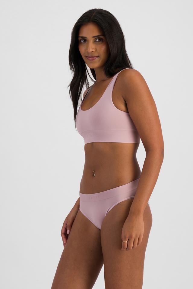 NAYA (She/Her) wears size 10 and is 174cm tall with 80cm chest and 63cm waist