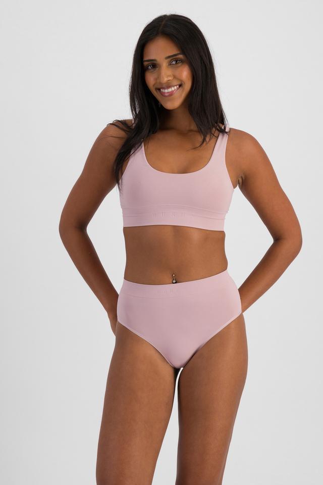 NAYA (She/Her) wears size 10 and is 174cm tall with 80cm chest and 63cm waist