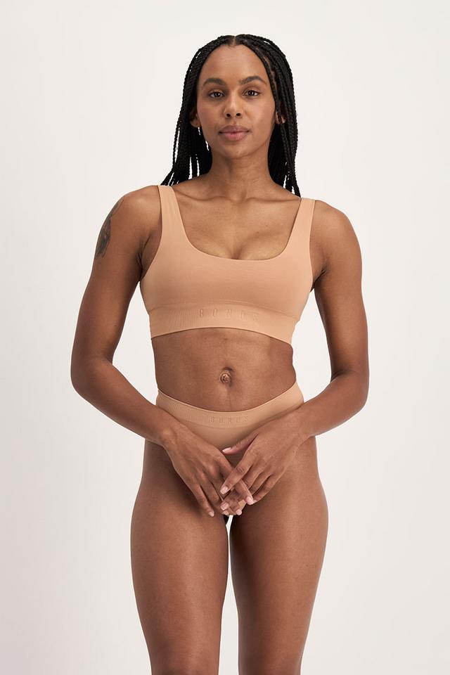 Tani (She/Her) wears size 12 and is 171cm tall with 74cm chest and 61cm waist