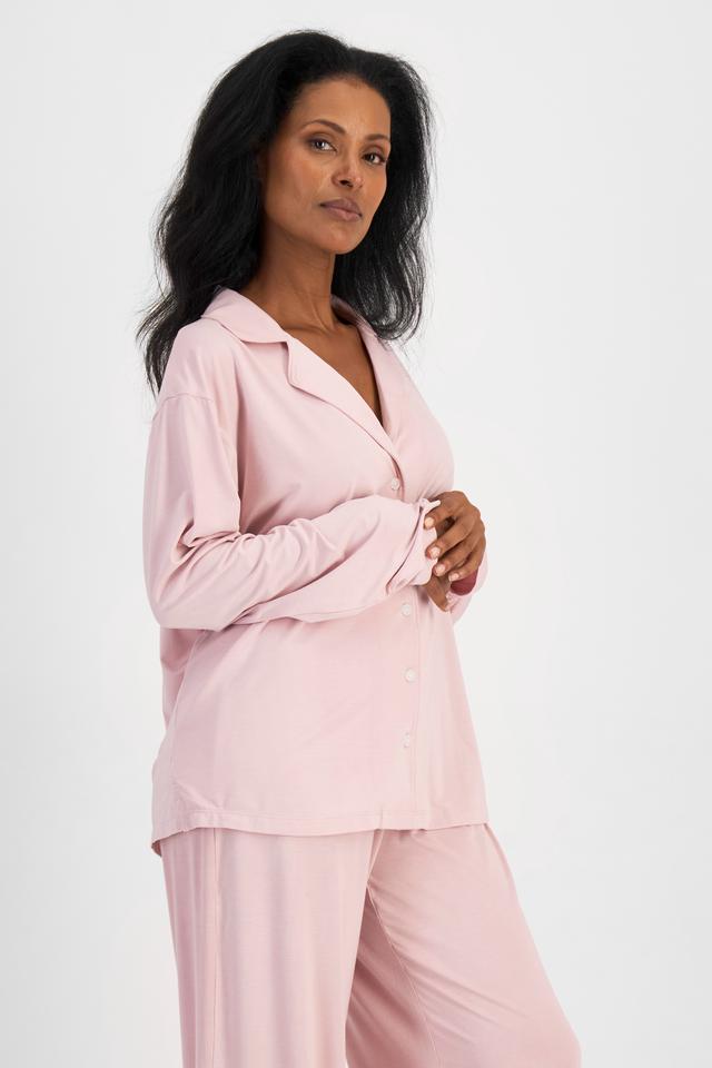 Senait (She/Her) wears size S and is 162cm tall with 79cm chest and 60cm waist