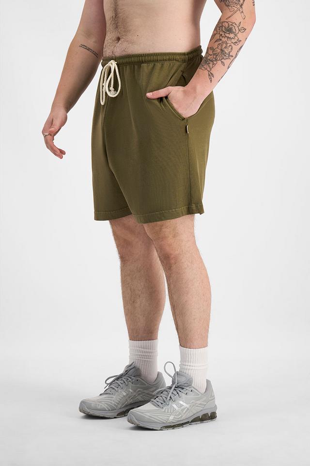 Sam (He/Him) wears size XL and is 178cm tall with 112cm chest