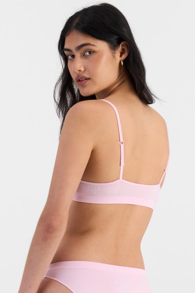 Tiana (She/Her) wears size 12B and is 176cm tall with cm chest and cm waist
