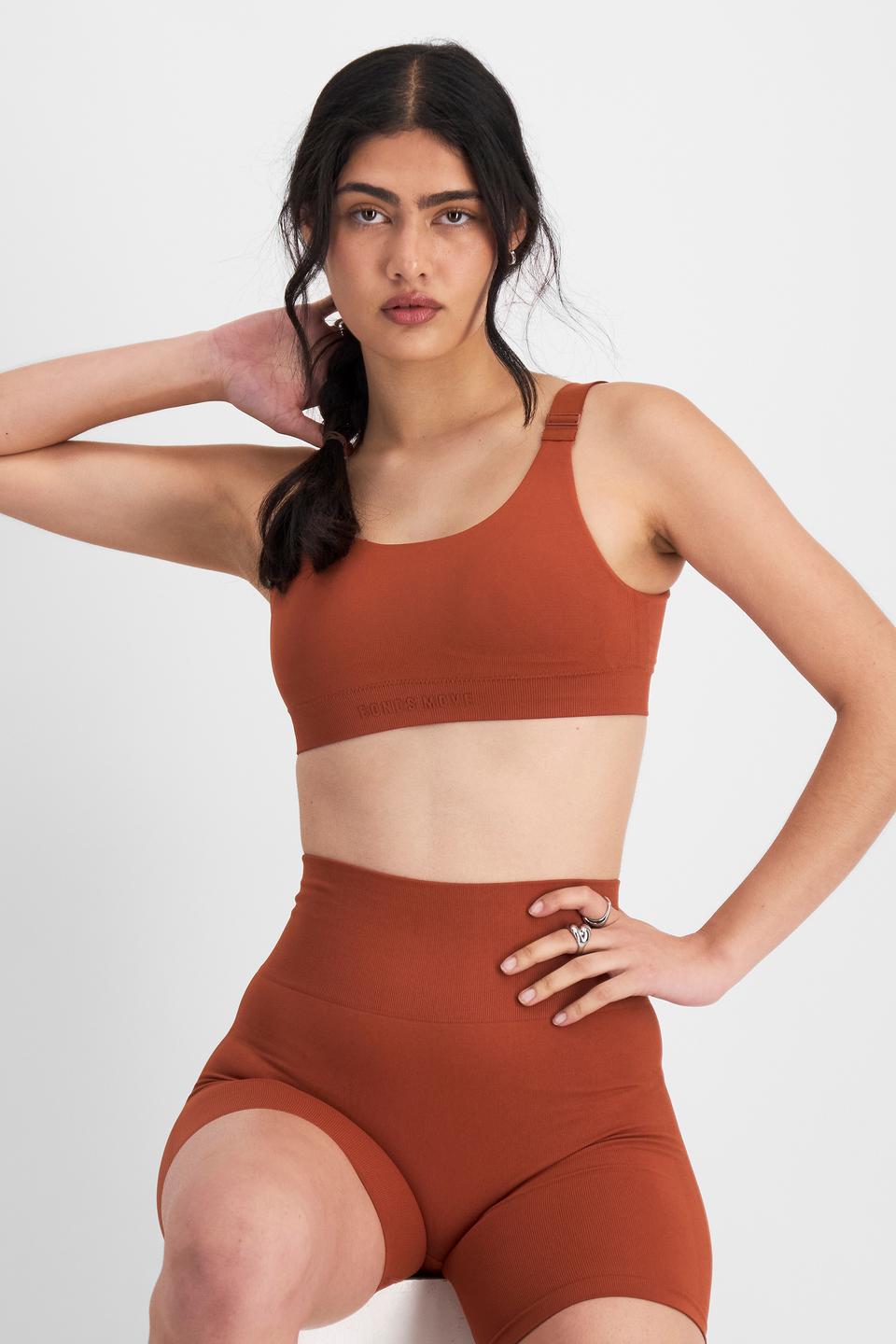 Tiana (She/Her) wears size 12B and is 176cm tall with cm chest and cm waist