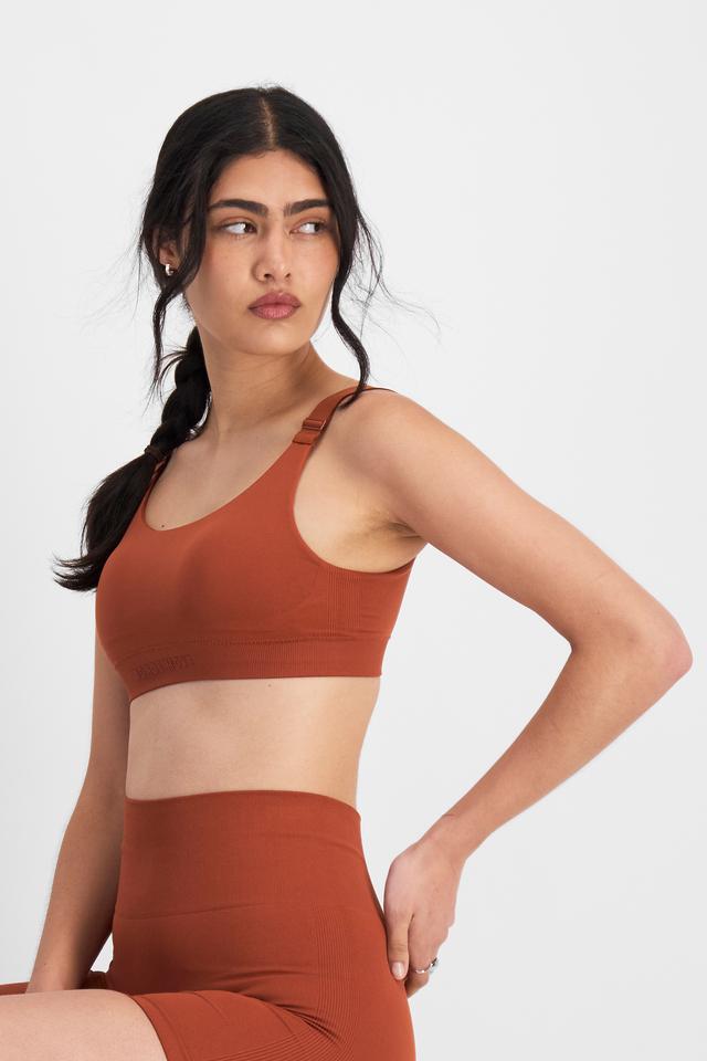 Tiana (She/Her) wears size 12B and is 176cm tall with cm chest and cm waist
