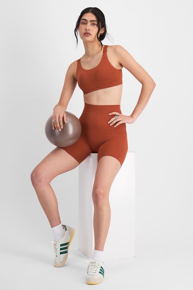 Tiana (She/Her) wears size 12B and is 176cm tall with cm chest and cm waist