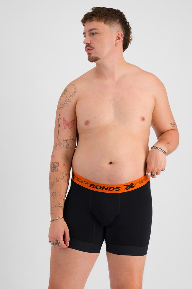 Jake (He/Him) wears size XL and is 195cm tall with 115cm chest and 106cm waist