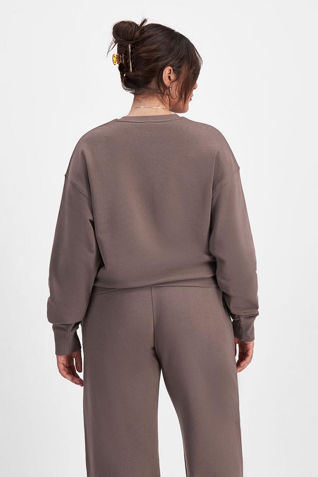 Bella (She/Her) wears size Large and is 173cm tall with 95cm chest and 77cm waist