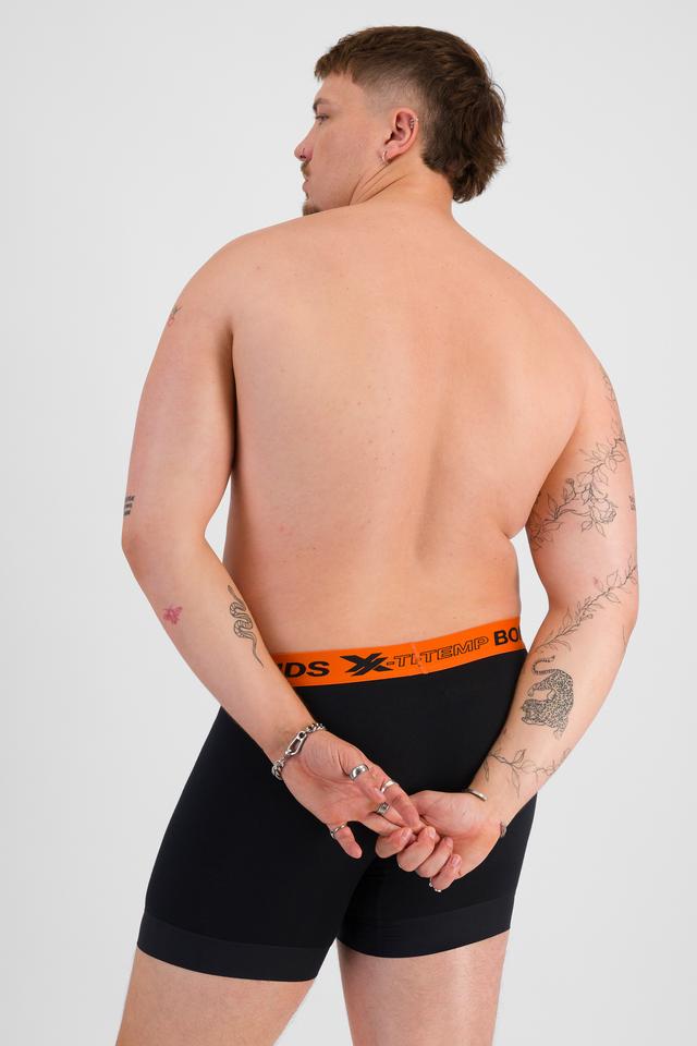 Jake (He/Him) wears size XL and is 195cm tall with 115cm chest and 106cm waist