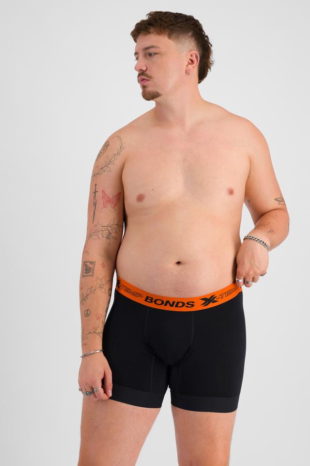 Jake (He/Him) wears size XL and is 195cm tall with 115cm chest and 106cm waist