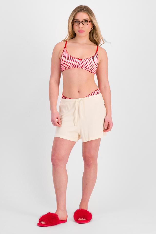 Sienna (She/Her) wears size 12 and is 164cm tall with cm chest and 71cm waist